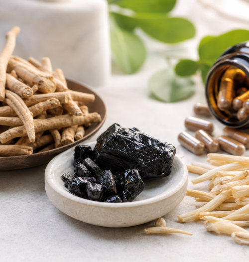 Ashwagandha roots, shilajit resin and herbal capsules